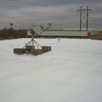 flat roof of warehouse with satellite dish